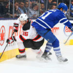 TORONTO , ON - DECEMBER 4: Jake Gardiner #51 of the Toronto Maple Leafs runs into Jacob Josefson #16 of the New Jersey Devils during NHL game action December 4, 2014 at the Air Canada Centre in Toronto, Ontario, Canada. (Photo by Graig Abel/NHLI via Getty Images)