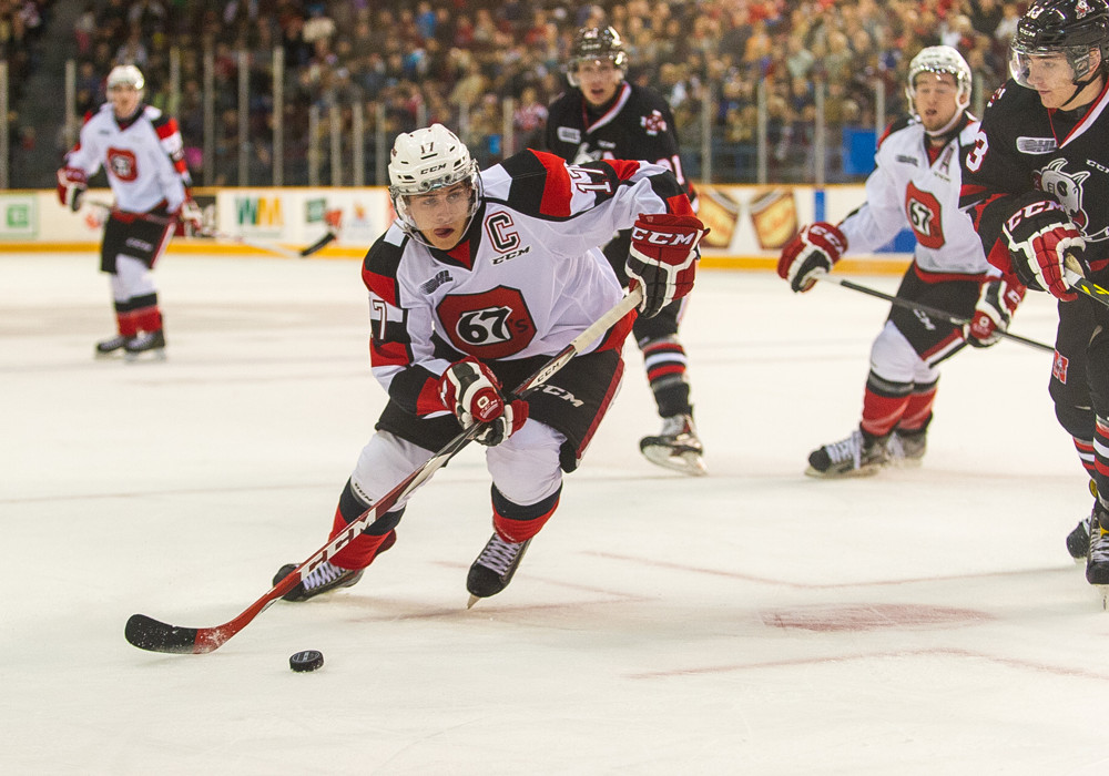 October 10, 2014: Ottawa 67's captain Travis Konecny (#17) with the puk during the game between the Ottawa 67's and the Niagara IceDogs, held at TD Place Arena, Ottawa. The 67's won 4-3 in their first game back at TD Place Arena.