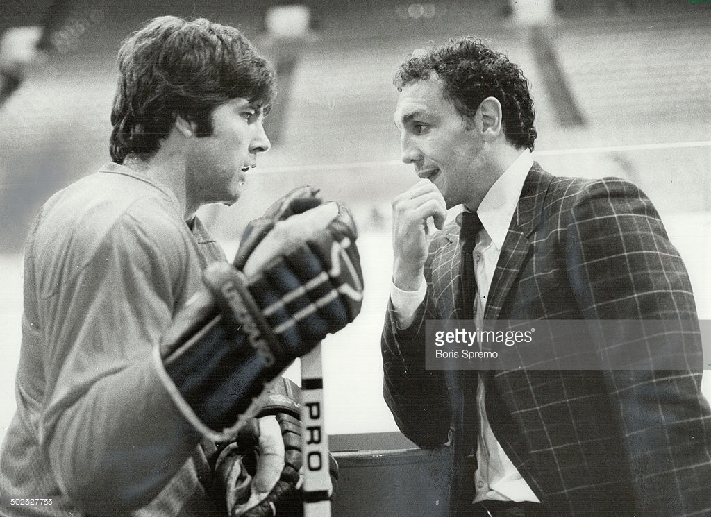 Fraternizing: Leaf defenceman Ian Turnbull (left) stops to chat with former teammate Tiger Williams now a Vancouver Canuck; as their path crossed during practice sessions at the Gardens.