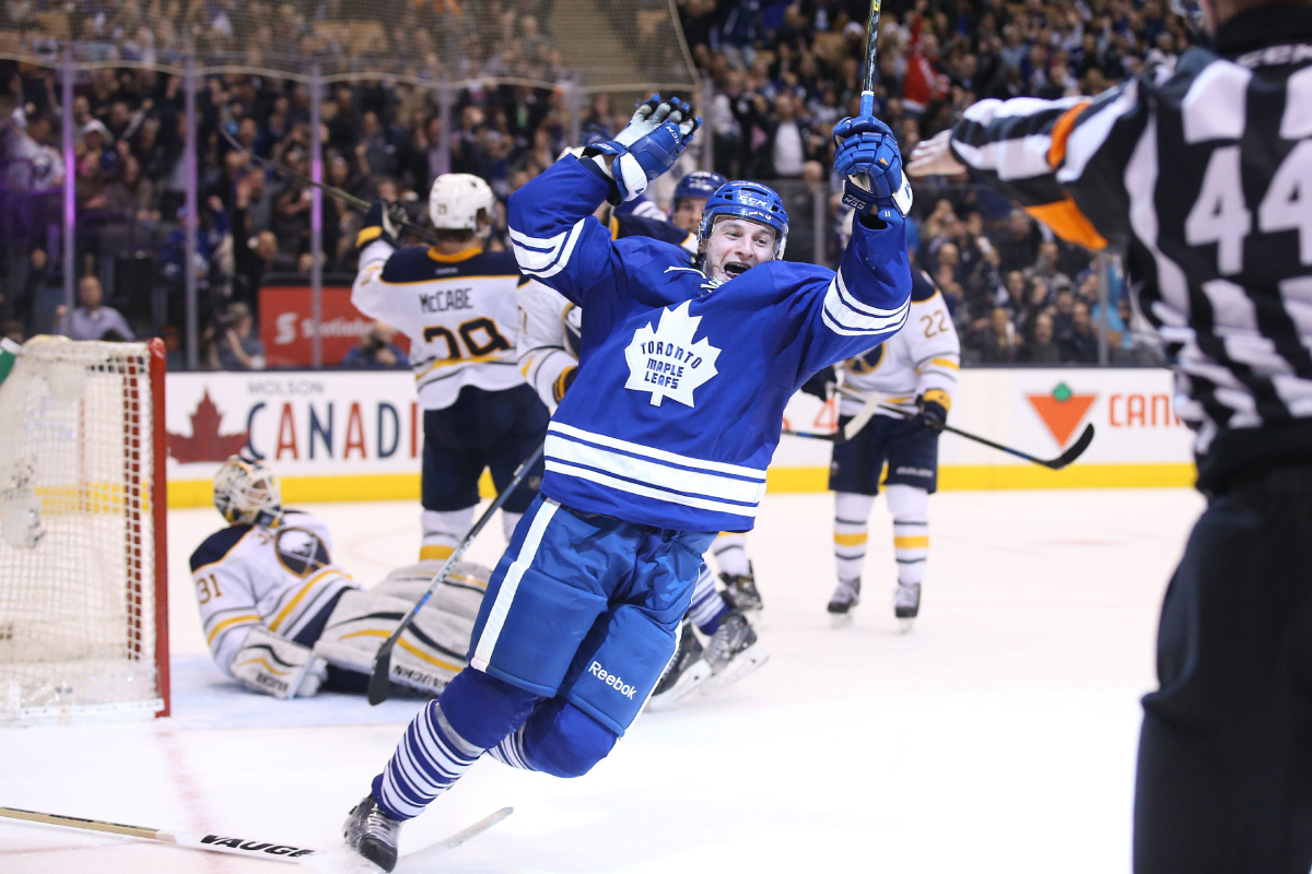 Mar 7, 2016; Toronto, Ontario, CAN; Toronto Maple Leafs center Zach Hyman (11) scores his first career NHL goal in the second period against the Buffalo Sabres at Air Canada Centre. Mandatory Credit: Tom Szczerbowski-USA TODAY Sports