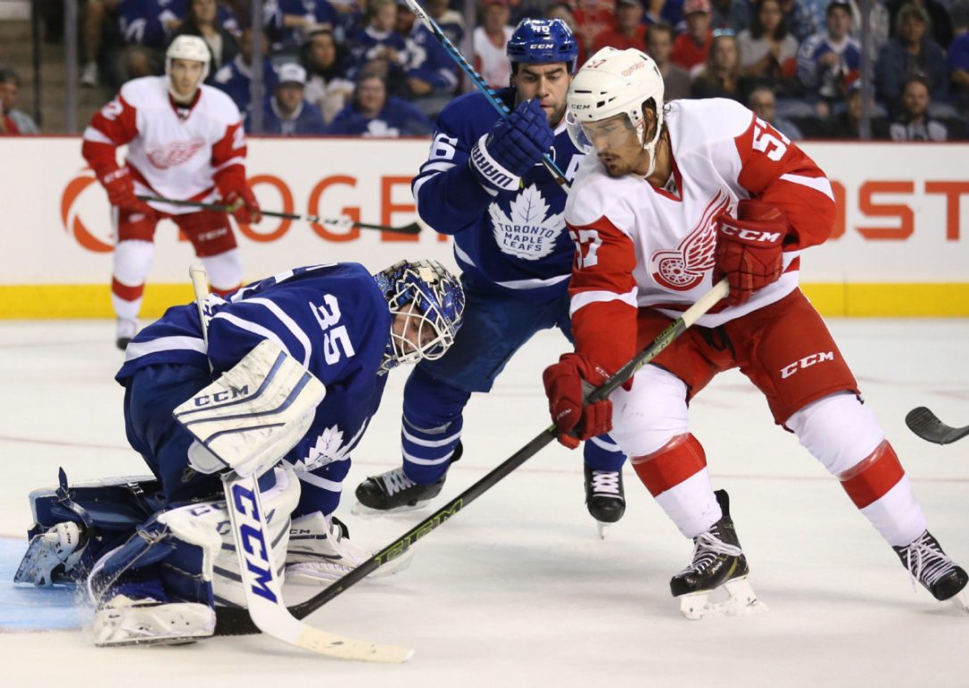 Maple Leafs goalie Jhonas Enroth gets a piece of Mitch Callahan's redirect in the second period of Friday night's game against the Wings in Hamilton. (PETER POWER / THE CANADIAN PRESS) 
