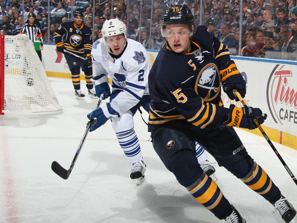 Matt Hunwick #2 of the Toronto Maple Leafs defends against Jack Eichel #15 of the Buffalo Sabres at First Niagara Center on October 21, 2015 in Buffalo, New York. (Photo by Jen Fuller/Getty Images) 